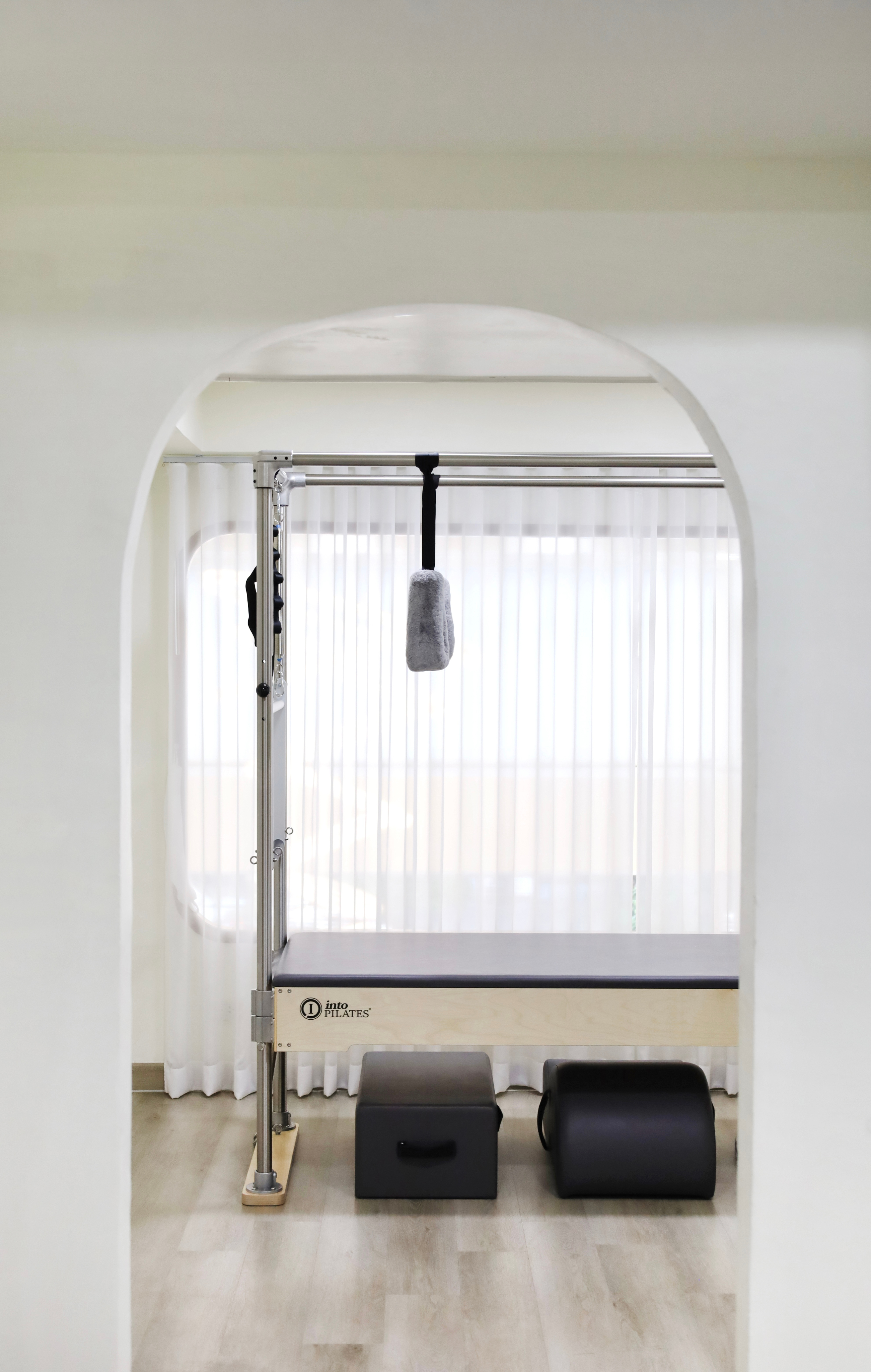 Pilates cadillac equipment in a private session room