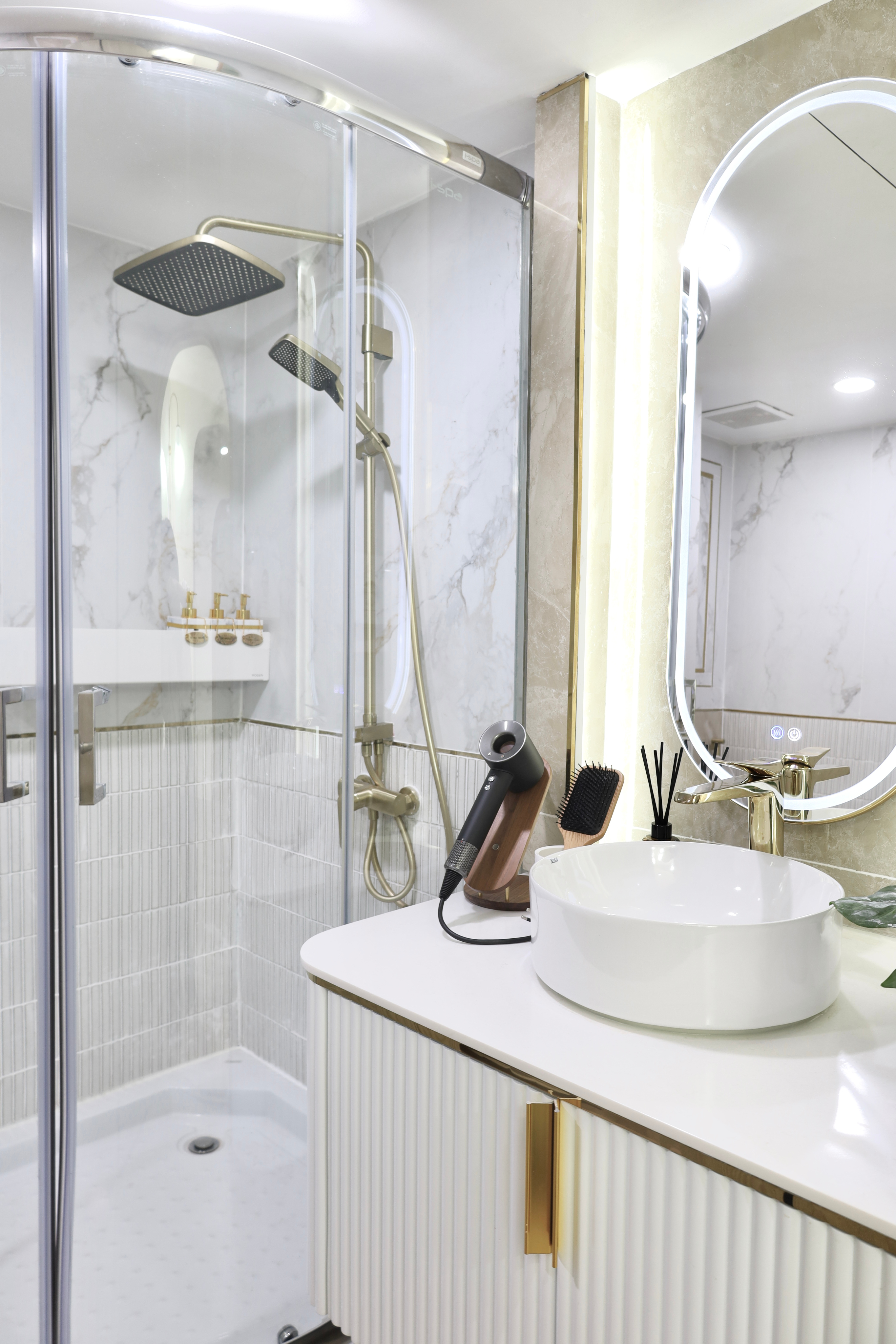 Private shower room with rain shower and vanity at The Best Pilates
