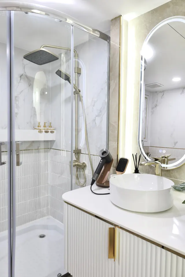 Private shower room with rain shower and vanity at The Best Pilates